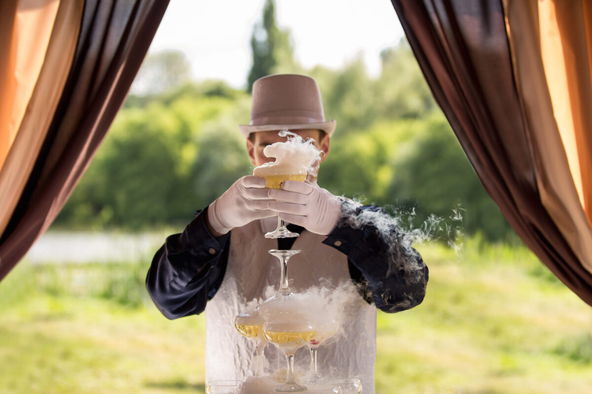 Bartender,With,Champagne,Glass,And,Dry,Ice.,Cocktail,Party.